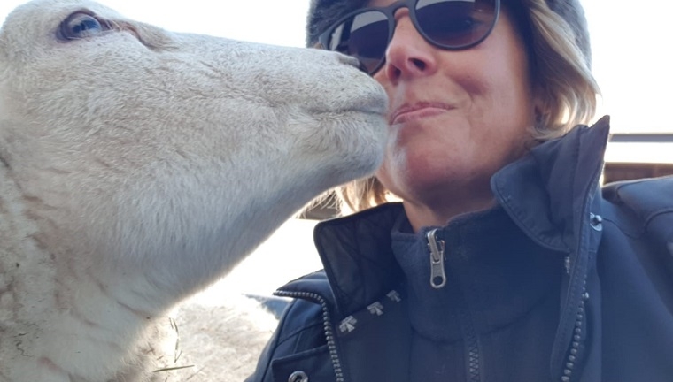 tails in the city owner julia with white goat in animal charity visit